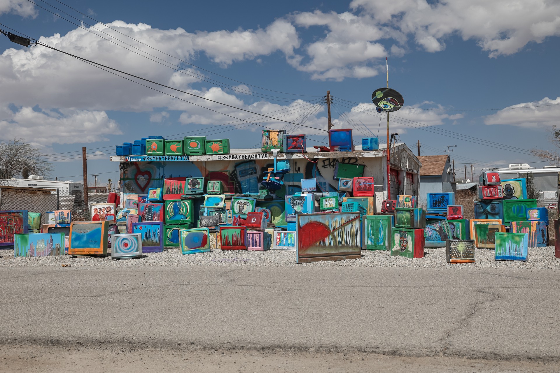 Colorful television sets are placed on an otherwise abandoned lot in Bombay Beach